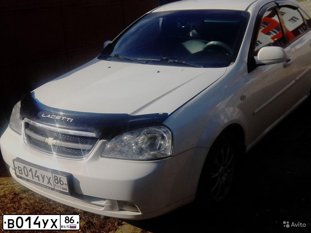 Фото автомобиля CHEVROLET LACETTI, 2006 — госномер В014УХ86. Цвет: Белый