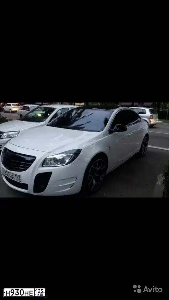 Фото автомобиля OPEL INSIGNIA, 2013 — госномер К590КУ774. Цвет: Белый
