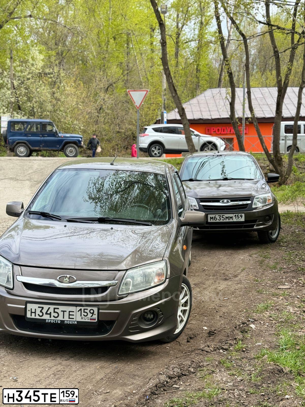 Фото автомобиля LADA 2190 GRANTA, 2015 — госномер Н345ТЕ159. Цвет: Золотисто-коричневый