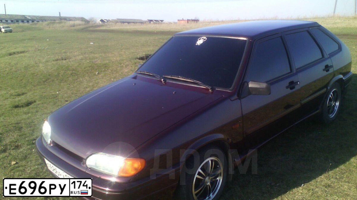 Фото автомобиля FORD FOCUS, 2013 — госномер Е696РУ174. Цвет: СЕРО-КОРИЧНЕВЫЙ