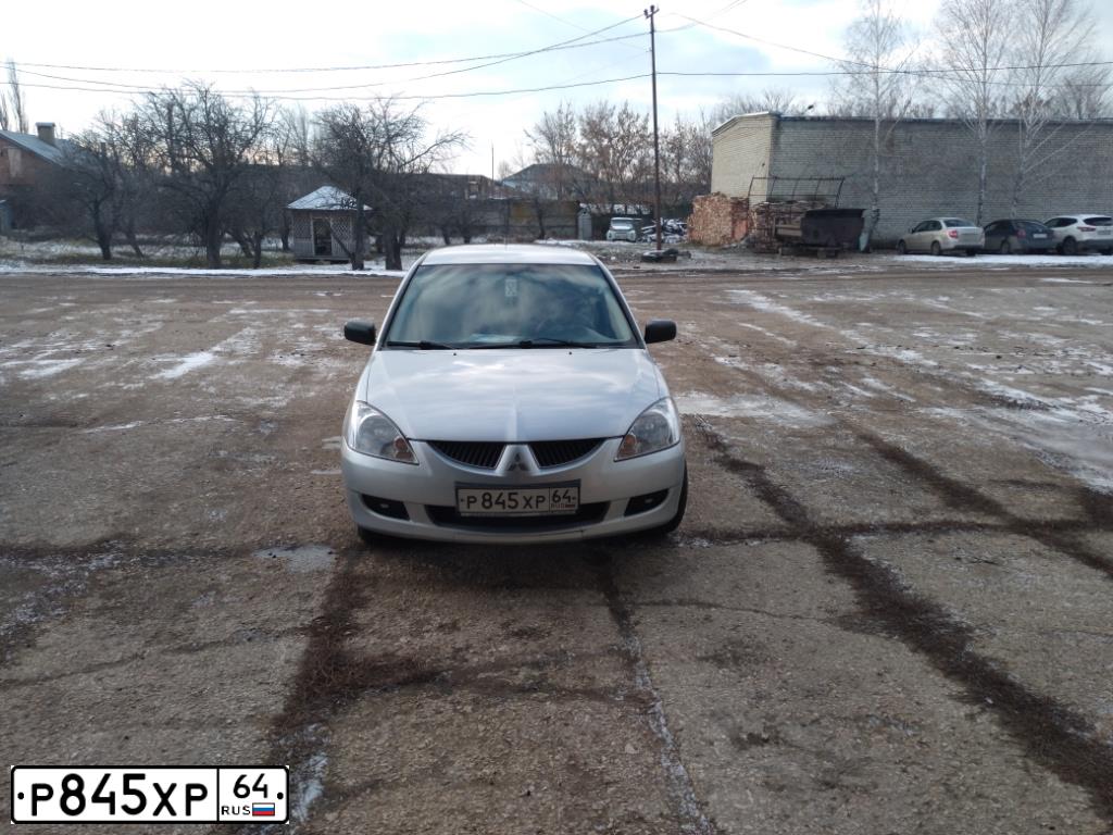 Фото автомобиля MITSUBISHI LANCER, 2003 — госномер Р845ХР64. Цвет: СЕРЕБРИСТЫЙ