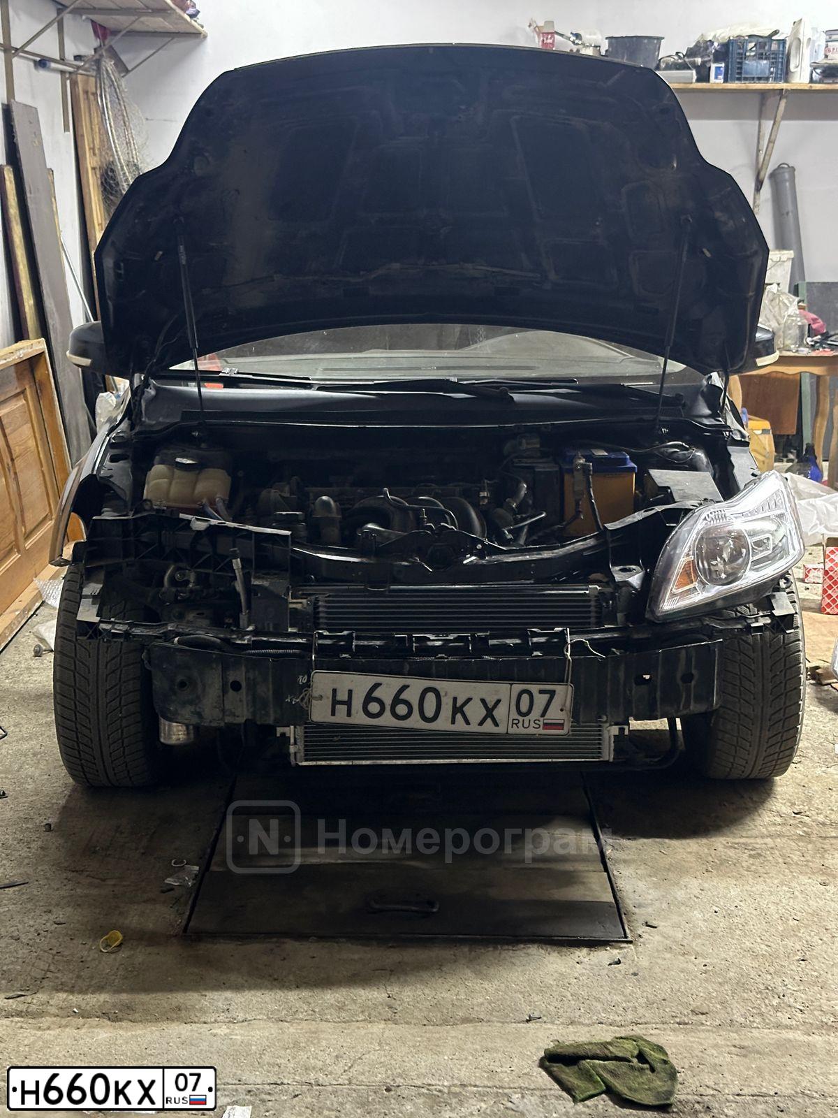 Фото автомобиля FORD FOCUS, 2010 — госномер Н660КХ07. Цвет: ЧЕРНЫЙ