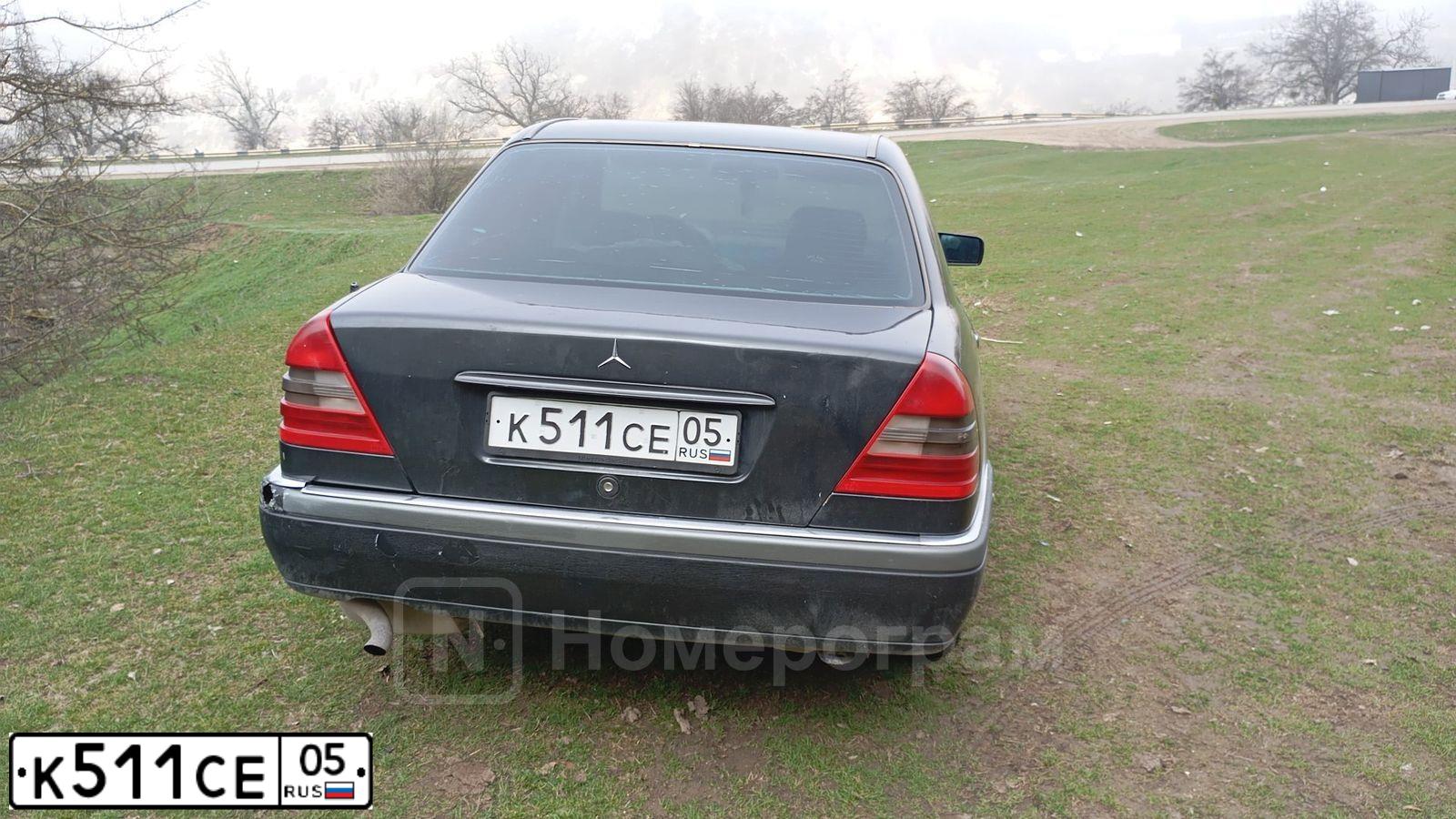 Фото автомобиля MERCEDES C-KLASSE, 1995 — госномер К511СЕ05. Цвет: ЧЕРНЫЙ