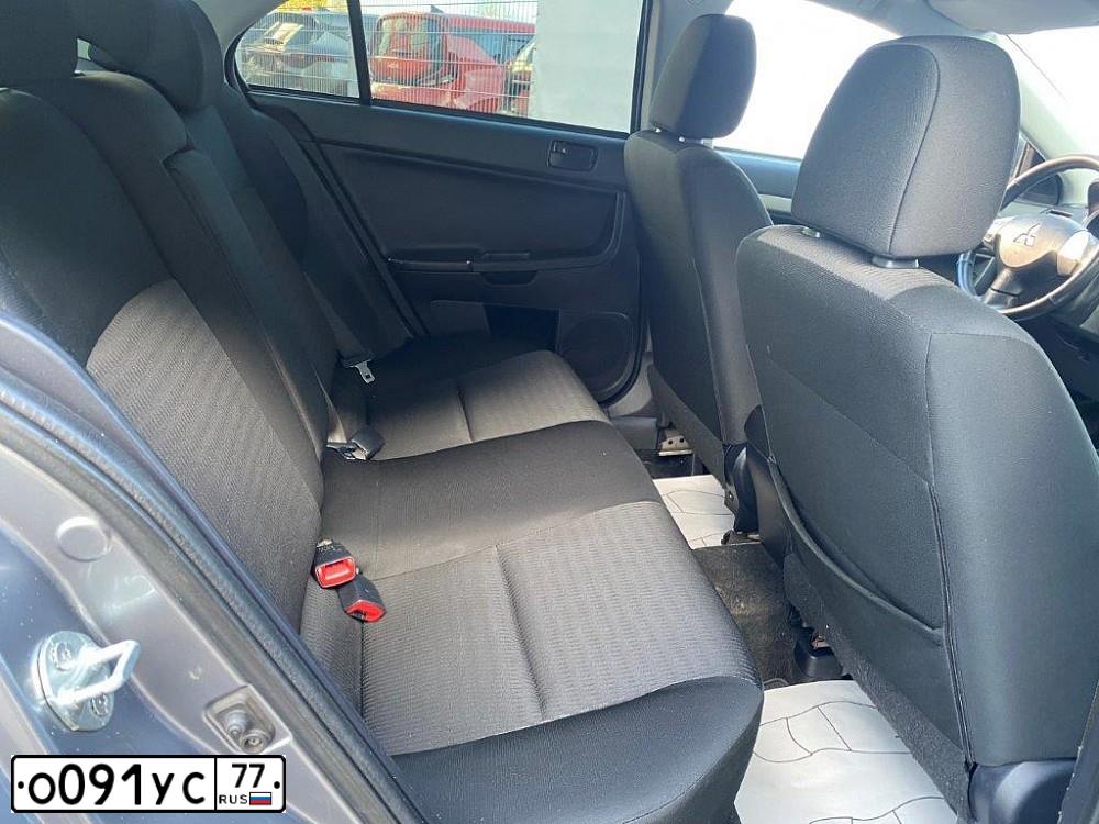 Фото автомобиля MITSUBISHI LANCER, 2012 — госномер У022ОР790. Цвет: Серый