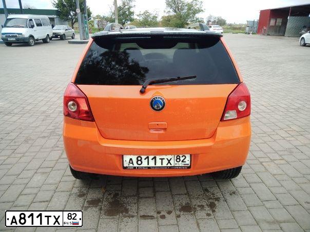 Фото автомобиля ДЖИЛИ MK-CROSS, 2012 — госномер А186ТР92. Цвет: Оранжевый