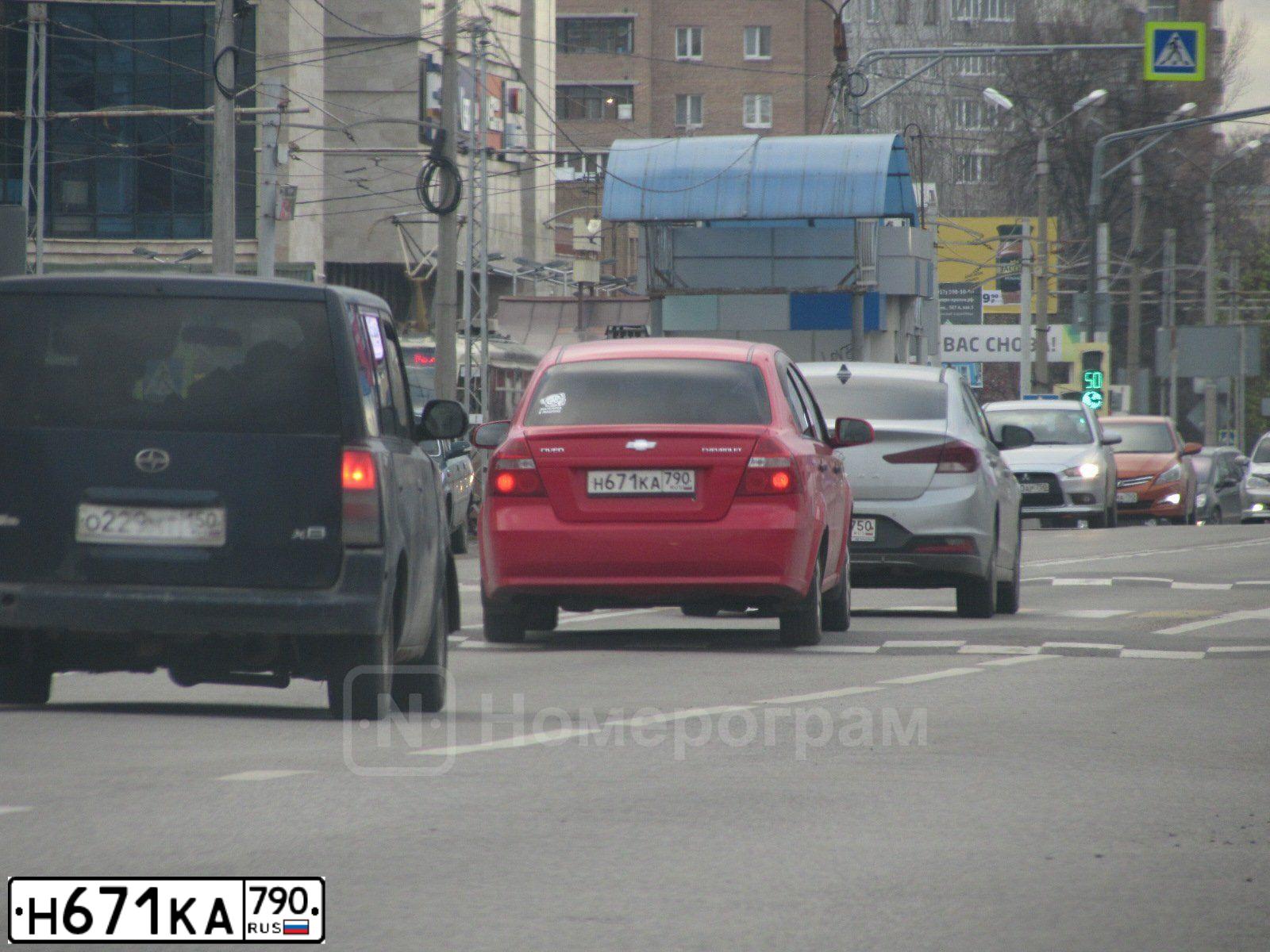 Фото автомобиля CHEVROLET AVEO, 2007 — госномер Н671КА790. Цвет: Красный