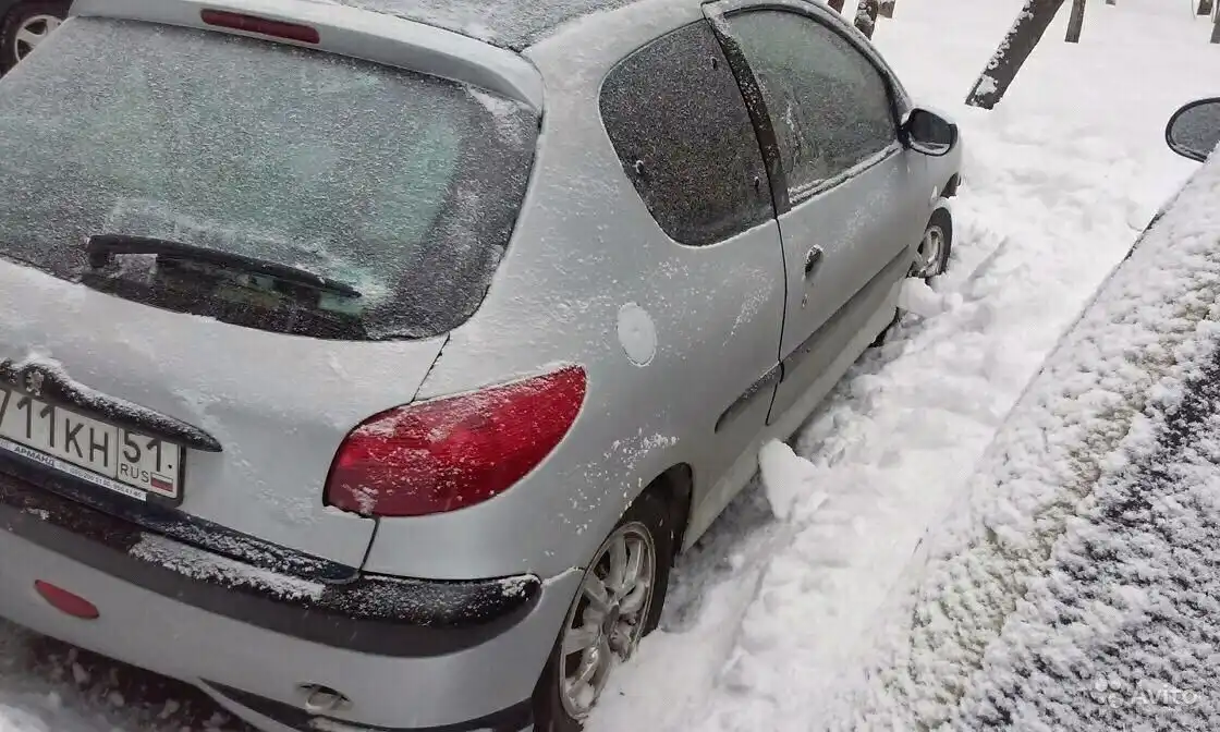 Фото автомобиля MITSUBISHI LANCER, 2004 — госномер Т711КН51. Цвет: СИНИЙ