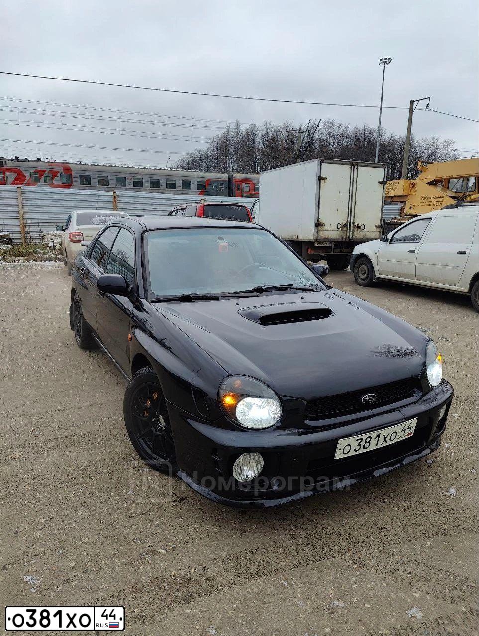 Фото автомобиля SUBARU IMPREZA, 2002 — госномер Р713АУ44. Цвет: Темно-синий