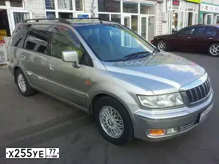 Фото автомобиля LADA 2121 NIVA, 1997 — госномер Х255УЕ77. Цвет: ВИШНЯ