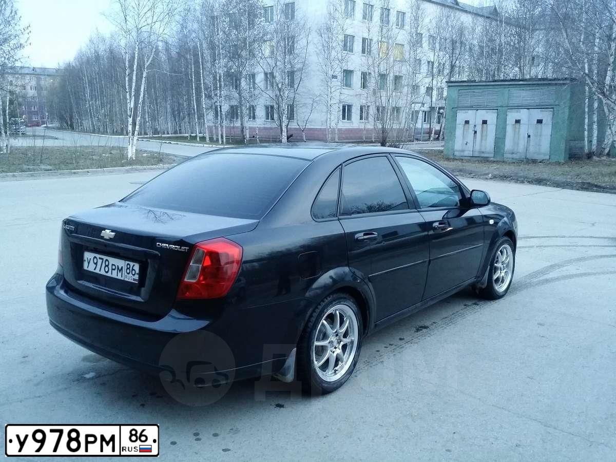 Фото автомобиля CHEVROLET T LACETTI, 2006 — госномер Х321ТЕ55. Цвет: ЧЕРНЫЙ