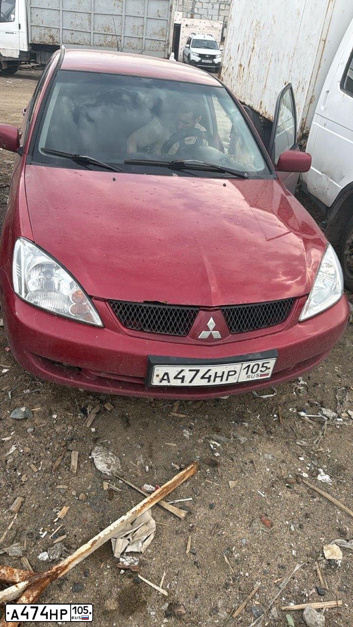 Фото автомобиля MITSUBISHI LANCER, 2003 — госномер А474НР105. Цвет: Красный