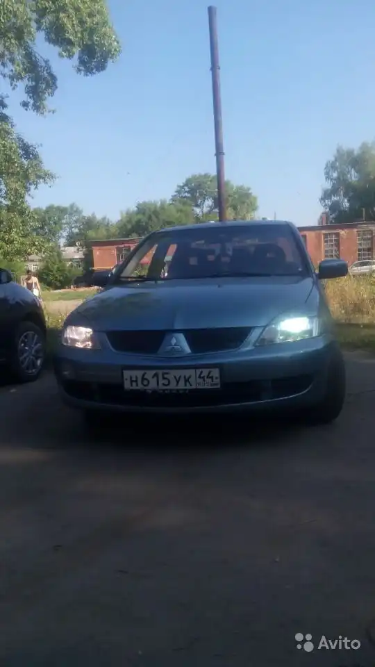 Фото автомобиля MITSUBISHI LANCER, 2006 — госномер С221АТ790. Цвет: СВЕТЛО-СЕРО-ЗЕЛЕНЫЙ
