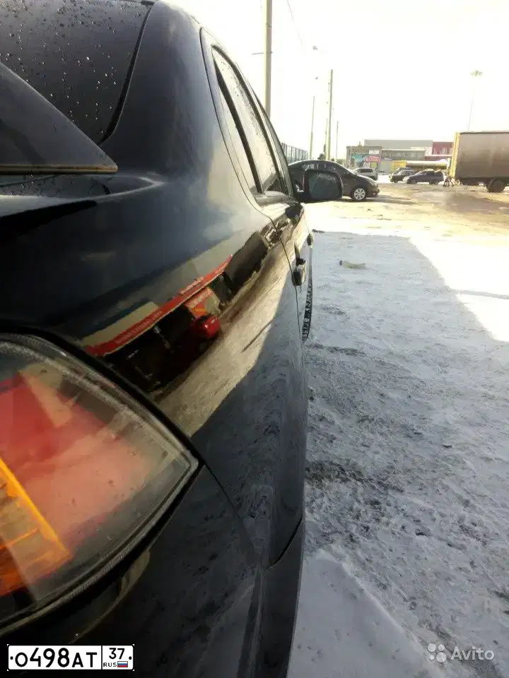 Фото автомобиля MITSUBISHI LANCER, 2012 — госномер М650СО21. Цвет: ЧЕРНЫЙ