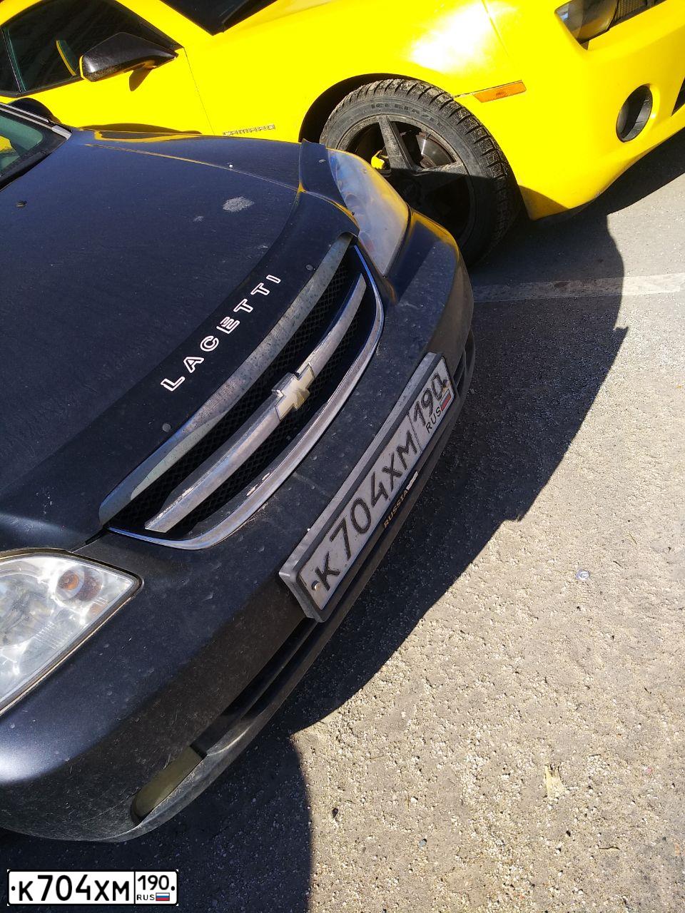 Фото автомобиля CHEVROLET LACETTI, 2008 — госномер К309НН199. Цвет: ЧЕРНЫЙ