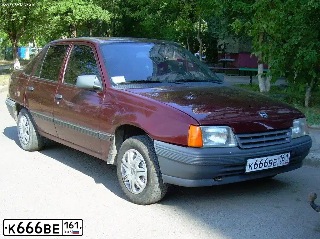 Фото автомобиля OPEL KADETT, 1991 — госномер К666ВЕ161. Цвет: ТЕМНО-КРАСНЫЙ