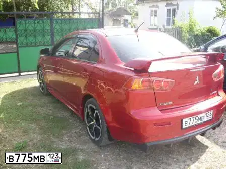 Фото автомобиля MITSUBISHI LANCER, 2007 — госномер В775МВ123. Цвет: Красный