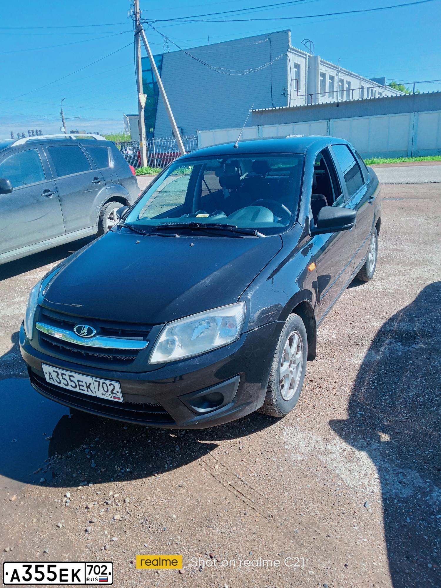 Фото автомобиля LADA GRANTA, 2016 — госномер Н712ТВ702. Цвет: ЧЕРНЫЙ