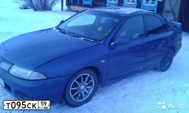 Фото автомобиля MITSUBISHI CARISMA, 1997 — госномер С100КР72. Цвет: Темно-синий