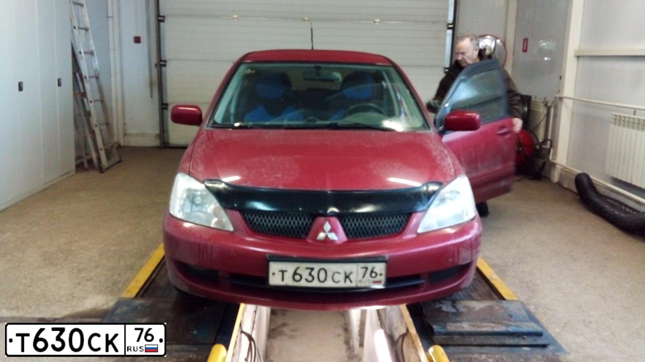 Фото автомобиля MITSUBISHI LANCER, 2006 — госномер Н044ЕМ198. Цвет: Красный
