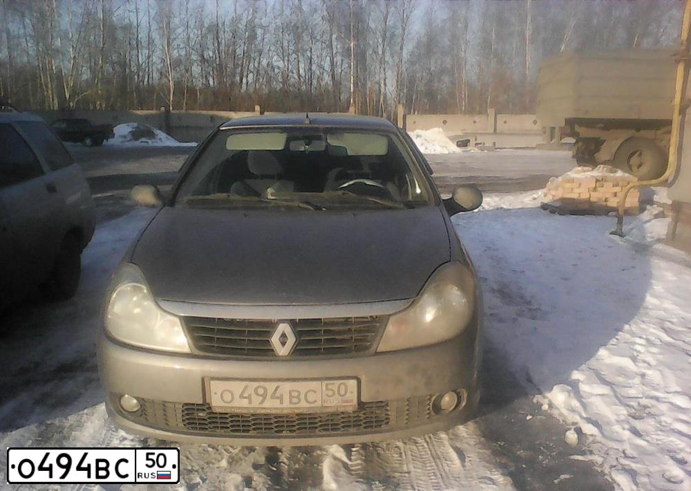 Фото автомобиля RENAULT SYMBOL, 2008 — госномер Е964КТ122. Цвет: ТЕМНО СЕРЫЙ