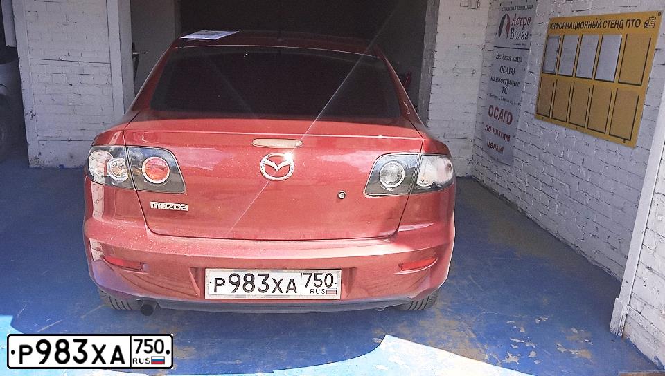 Фото автомобиля MAZDA A 3, 2008 — госномер О403МВ32. Цвет: Красный