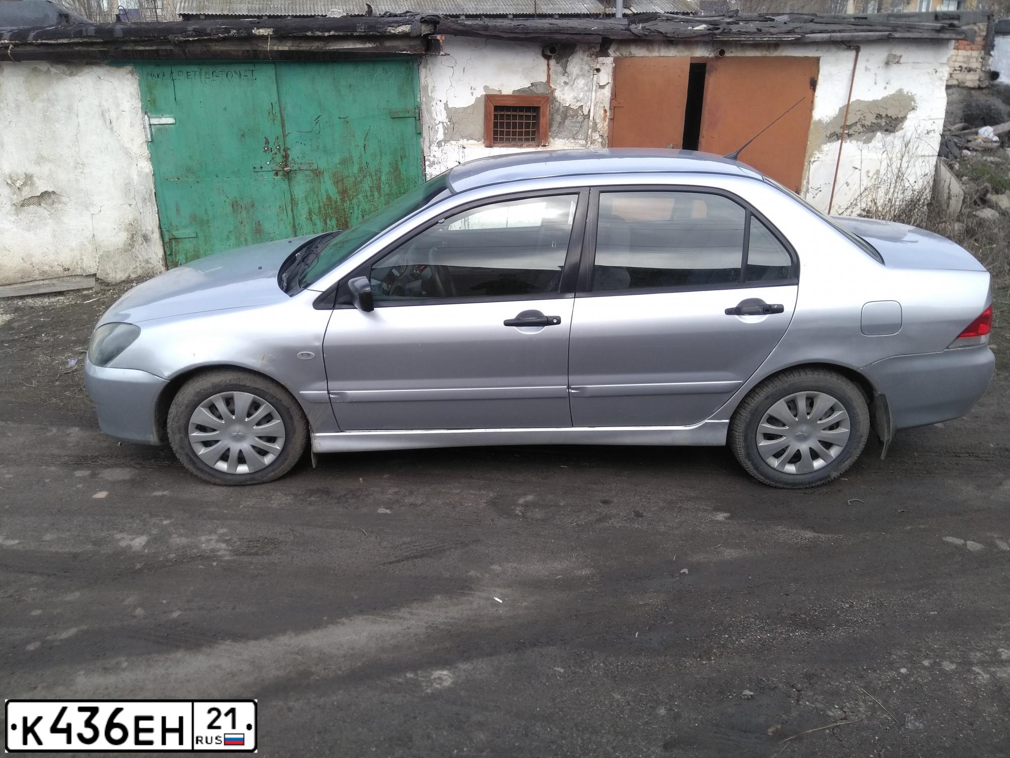 Фото автомобиля MITSUBISHI LANCER, 2004 — госномер К436ЕН21. Цвет: Серебристый