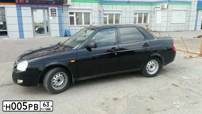 Фото автомобиля LADA 2112 LADA, 2007 — госномер М393СО86. Цвет: Темно-зеленый