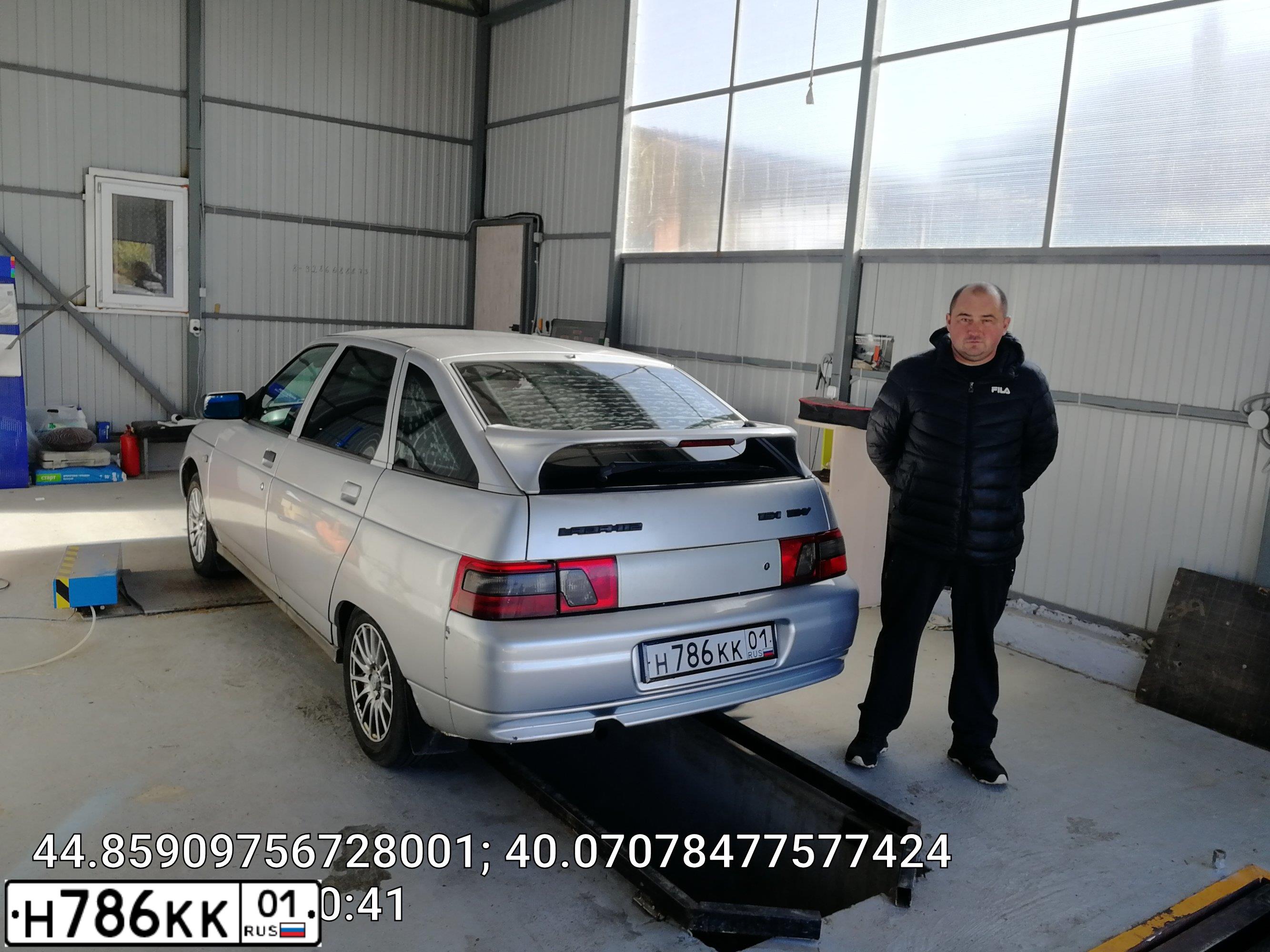 Фото автомобиля LADA 2112 LADA, 2005 — госномер Н786КК01. Цвет: СВЕТЛО-СЕРЕБ МЕТАЛИК