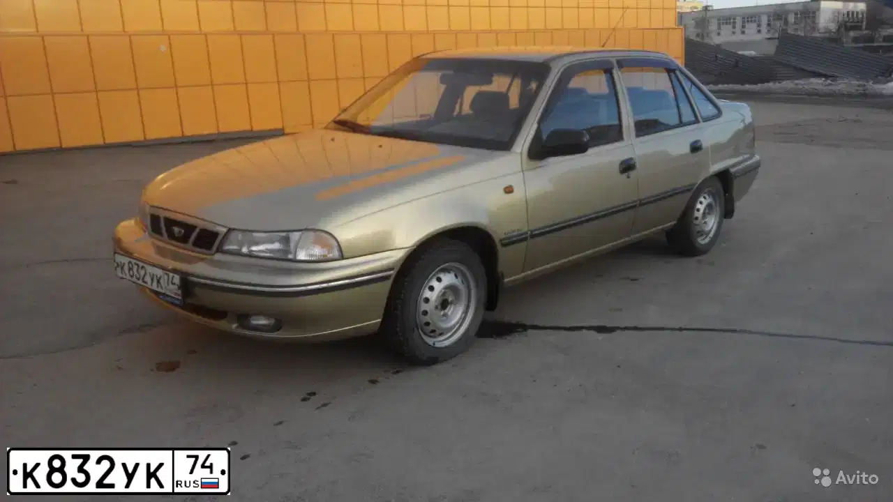 Фото автомобиля DAEWOO NEXIA, 2005 — госномер К832УК74. Цвет: ПЕСОЧНО-БЕЖЕВЫЙ
