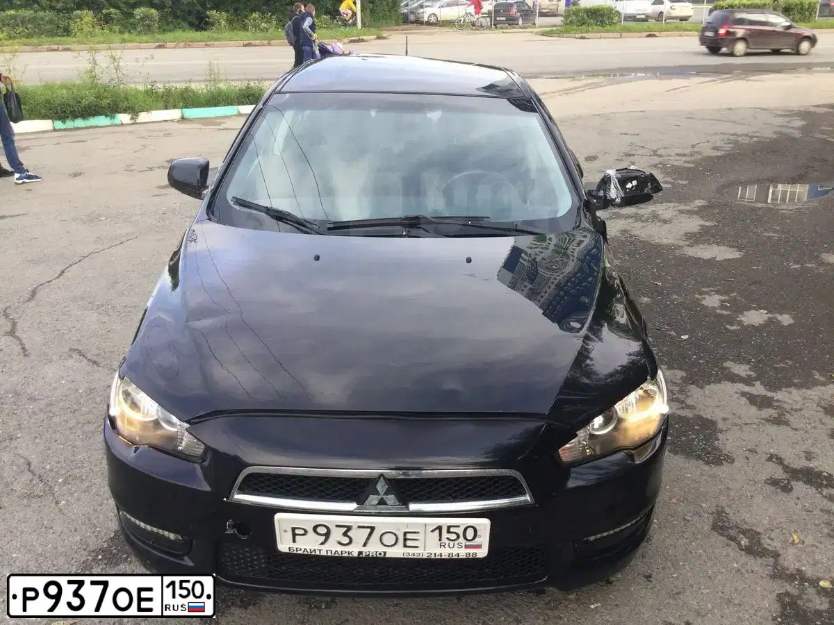 Фото автомобиля MITSUBISHI LANCER, 2007 — госномер Н101ОР159. Цвет: ЧЕРНЫЙ