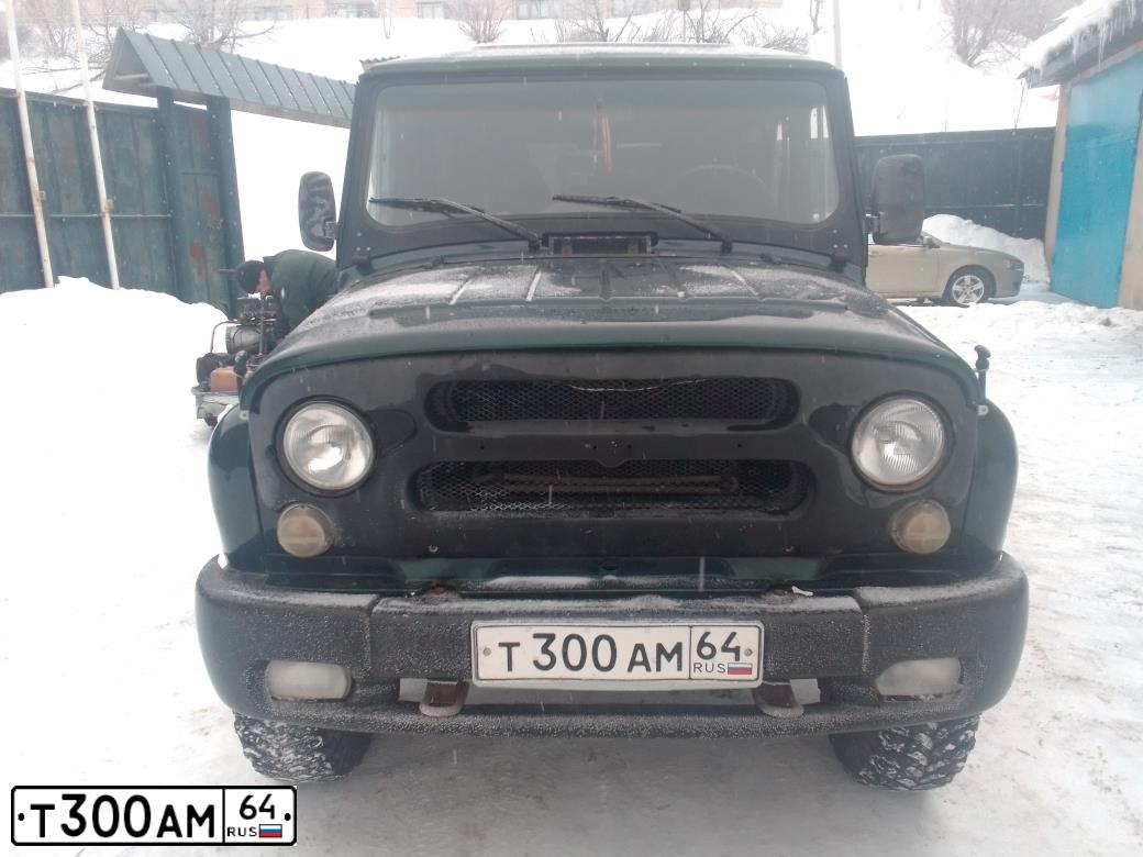 Фото автомобиля UAZ 3151 / HUNTER, 2008 — госномер Т300АМ64. Цвет: Темно-зеленый
