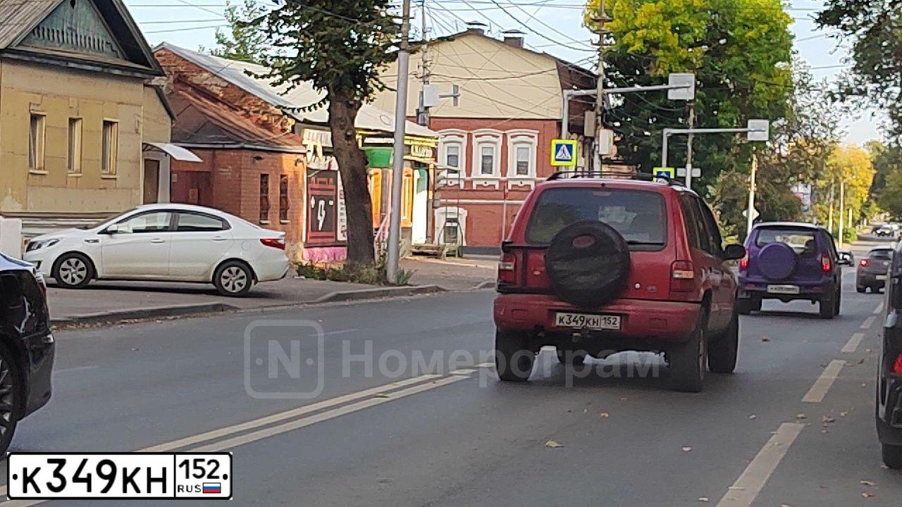 Фото автомобиля KIA SPORTAGE, 2001 — госномер К349КН152. Цвет: Красный