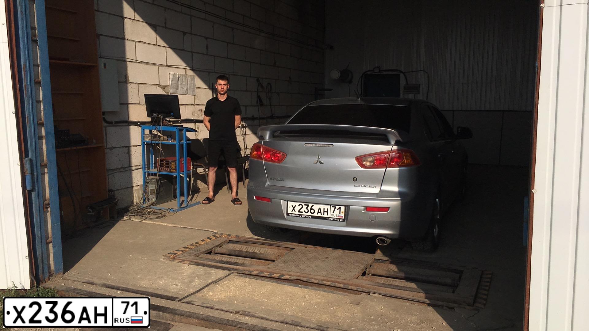 Фото автомобиля MITSUBISHI LANCER, 2008 — госномер Е464ХО71. Цвет: Серебристый