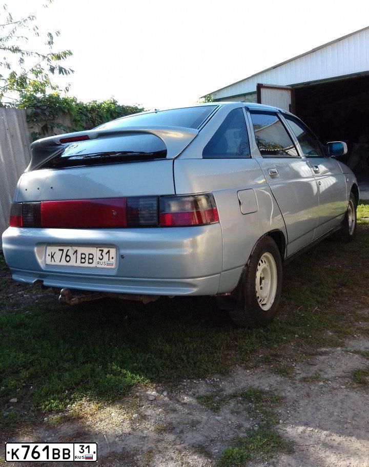 Фото автомобиля LADA 2112, 2004 — госномер К761ВВ31. Цвет: СЕРЕБРИСТО-ЖЕЛТЫЙ