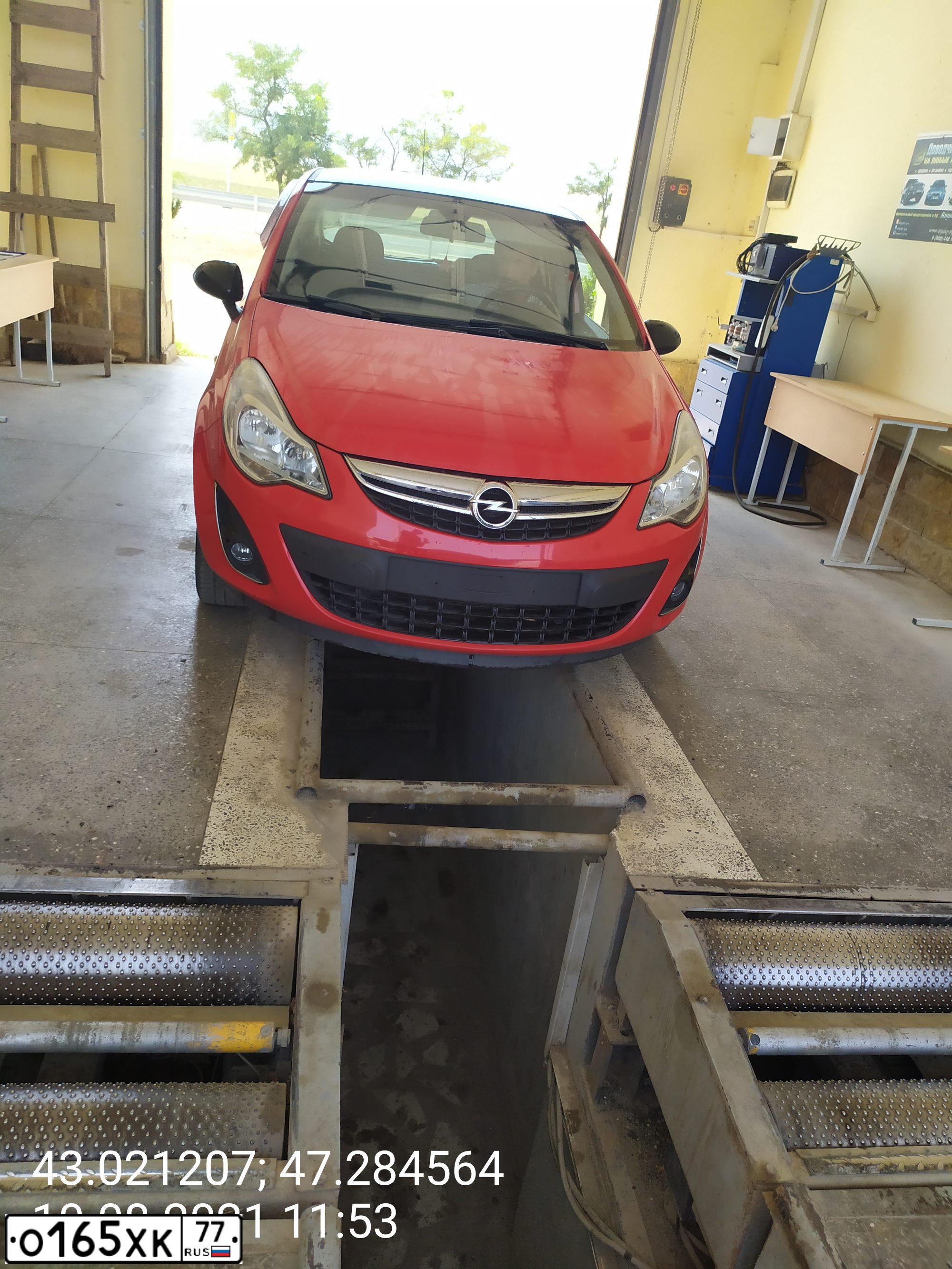 Фото автомобиля OPEL CORSA, 2012 — госномер Т061ВВ05. Цвет: КРАСНЫЙ