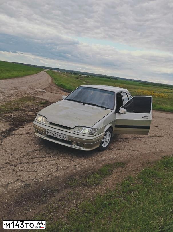 Фото автомобиля LADA 2114 SAMARA, 2006 — госномер М143ТО64. Цвет: СЕРЕБРИСТО-БЕЖЕВЫЙ