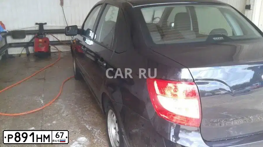 Фото автомобиля LADA 2190 GRANTA, 2013 — госномер Р891НМ67. Цвет: Сине-Черный