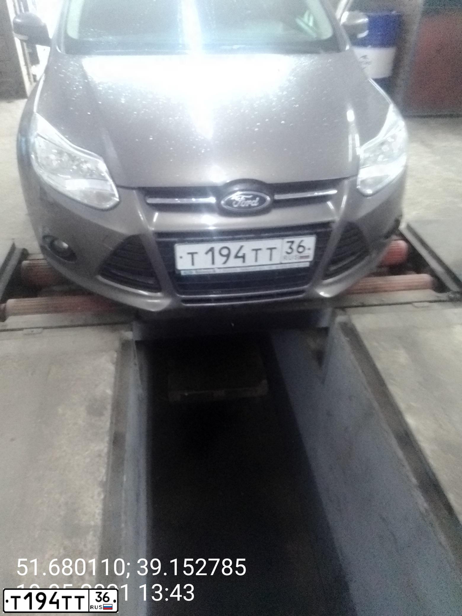 Фото автомобиля FORD FOCUS, 2012 — госномер Т194ТТ36. Цвет: СЕРО-КОРИЧНЕВЫЙ
