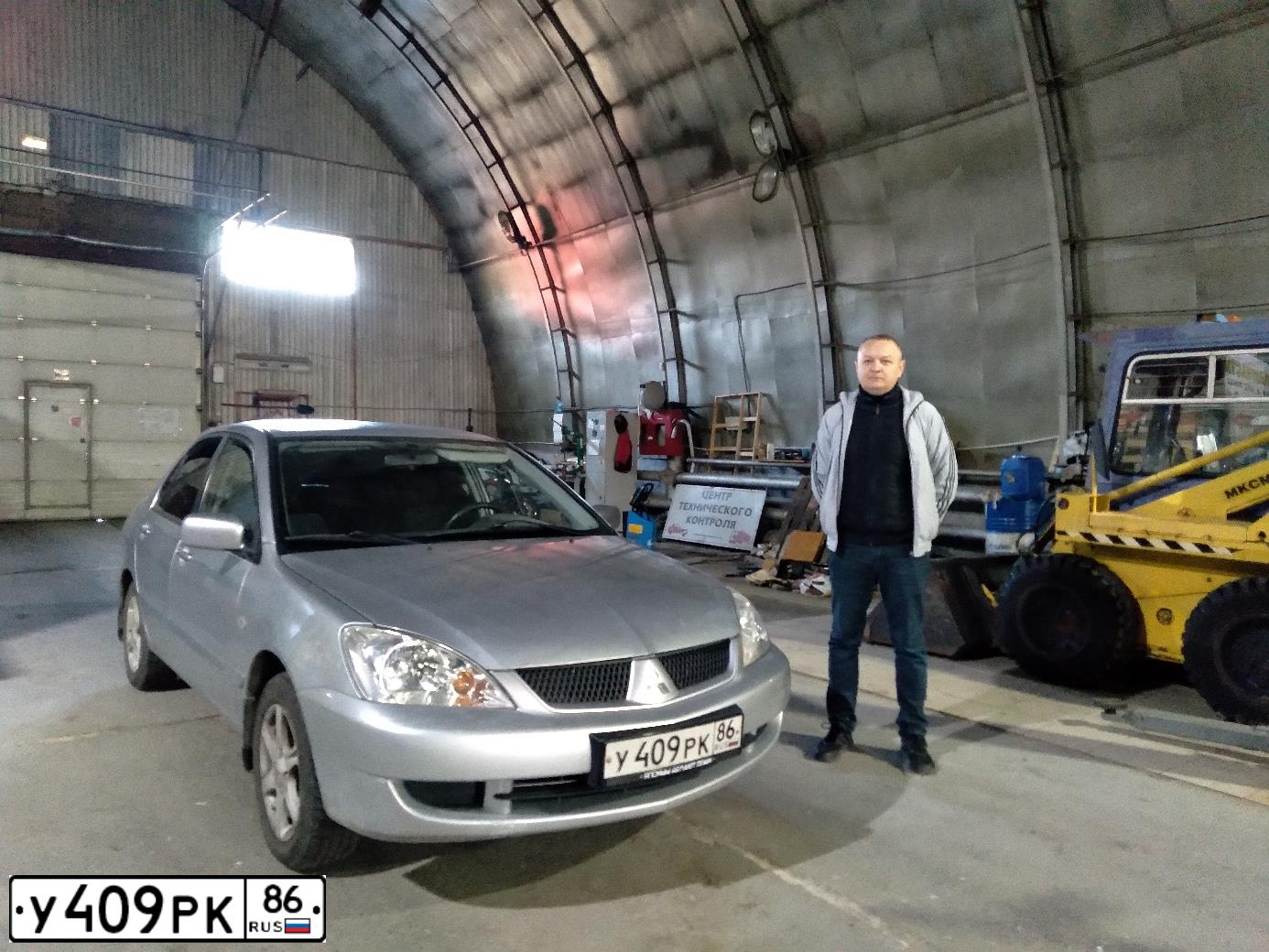 Фото автомобиля MITSUBISHI LANCER, 2006 — госномер Е608ХМ186. Цвет: СЕРЕБРИСТЫЙ