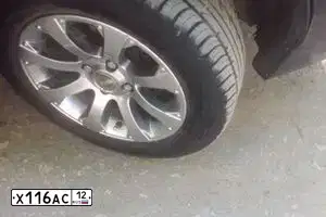 Фото автомобиля LADA 2112 LADA, 2006 — госномер М936РН21. Цвет: Темно-зеленый