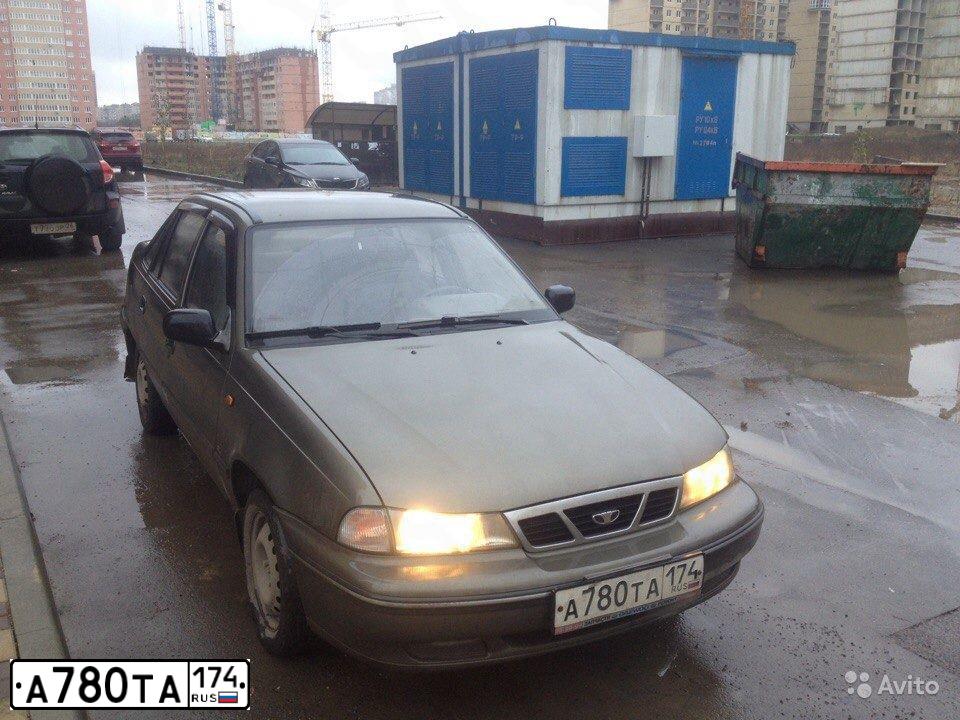 Фото автомобиля DAEWOO NEXIA, 2004 — госномер Н762ЕХ174. Цвет: СЕРО-БЕЖЕВЫЙ
