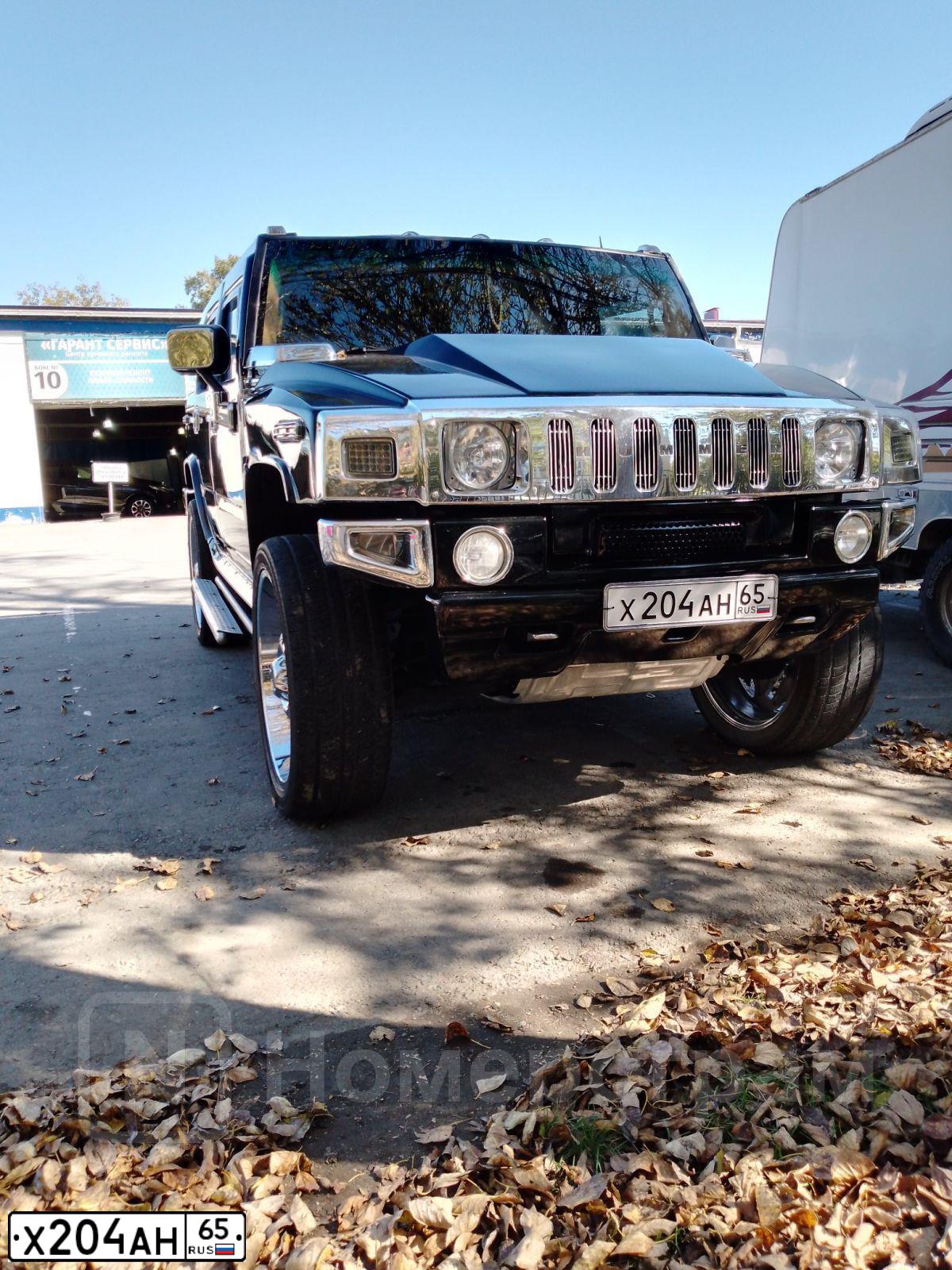 Фото автомобиля HUMMER H2, 2004 — госномер Н181НА65. Цвет: ЧЕРНЫЙ