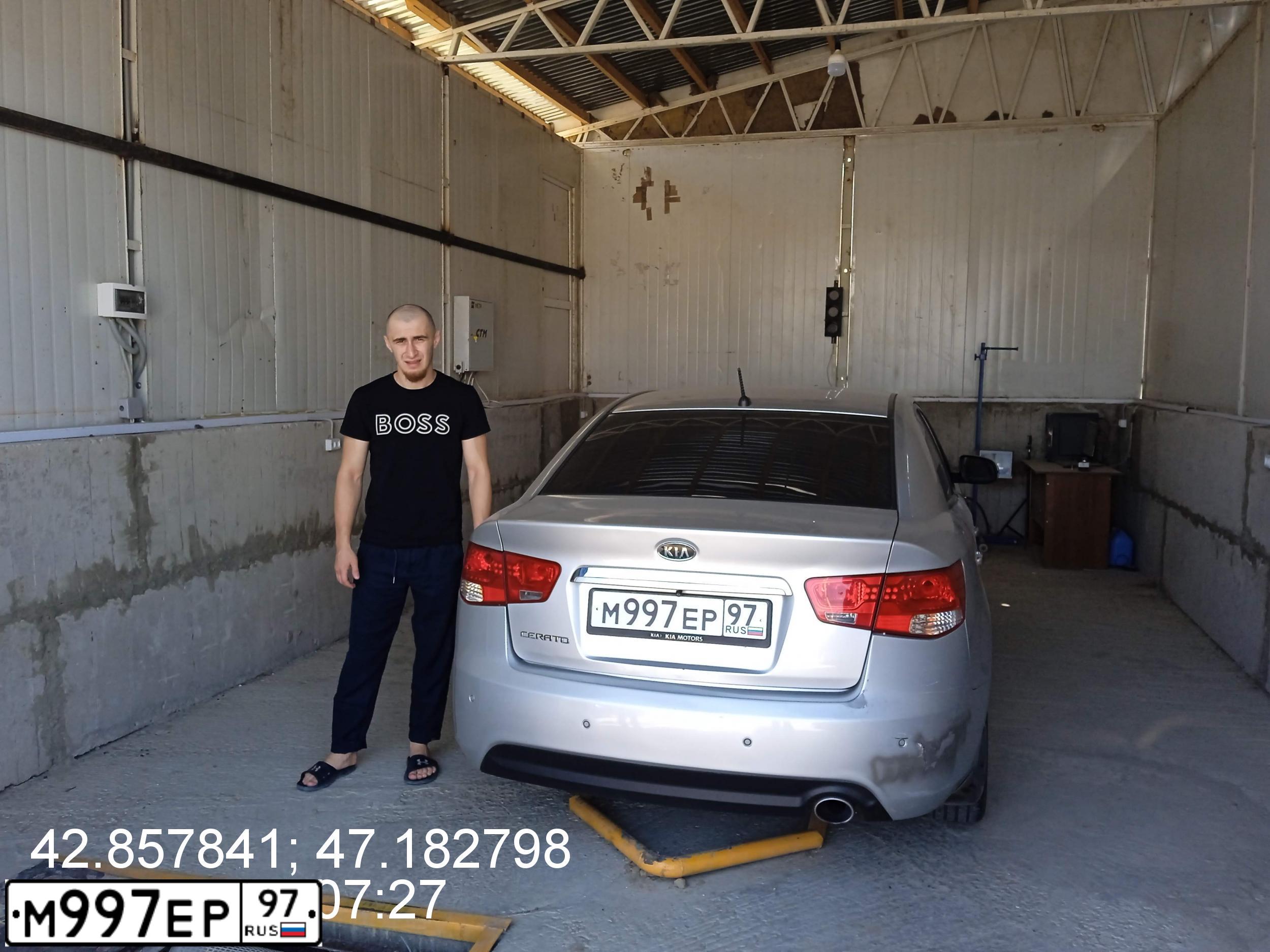 Фото автомобиля KIA CERATO, 2012 — госномер М997ЕР97. Цвет: Серебристый