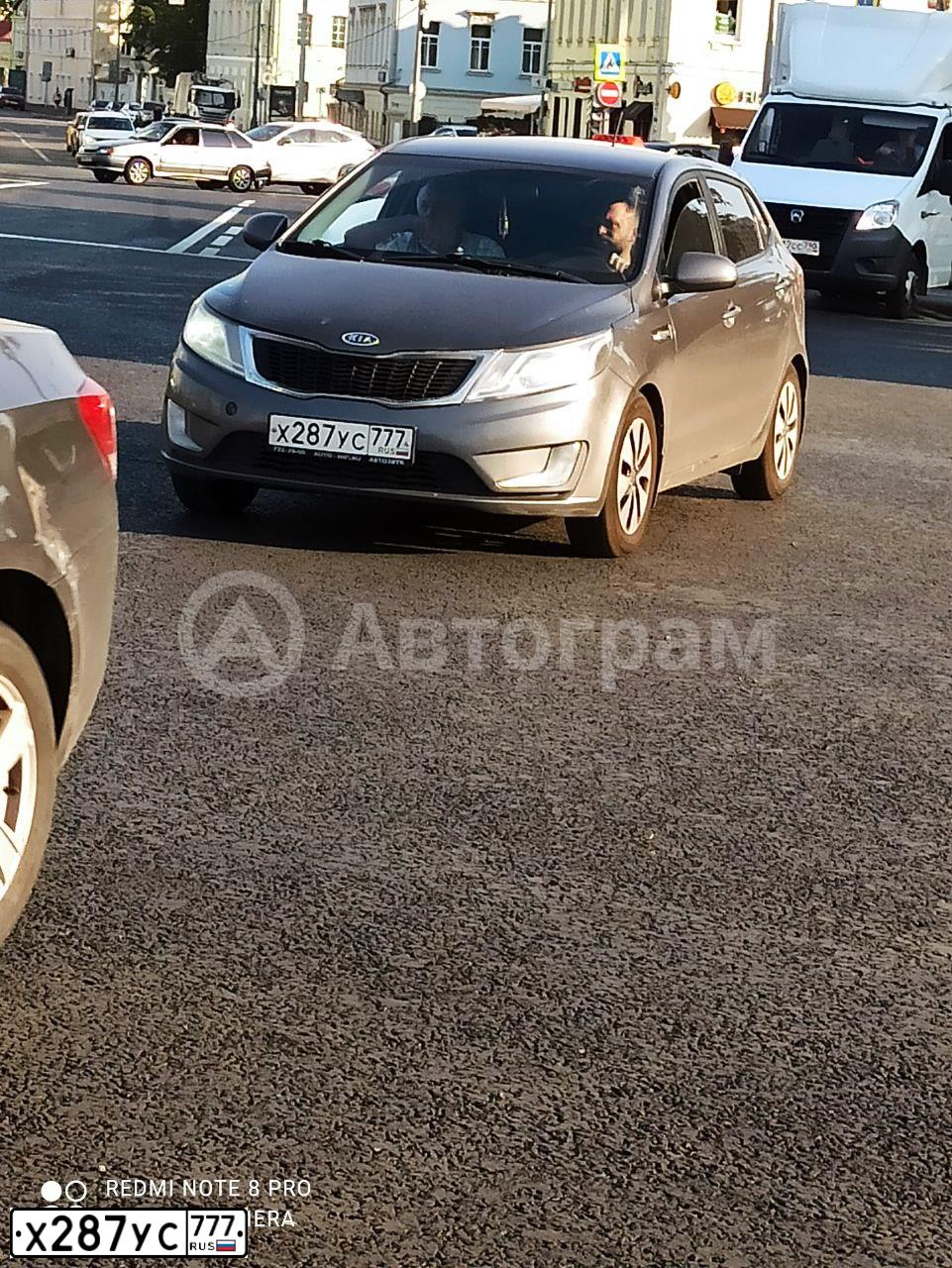 Фото автомобиля KIA RIO, 2012 — госномер Н064КО21. Цвет: СЕРЫЙ