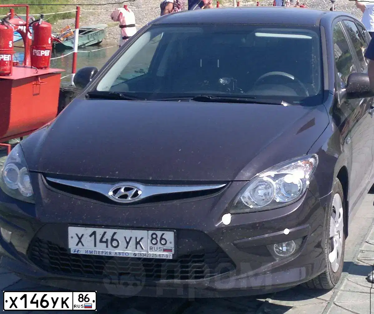 Фото автомобиля HYUNDAI I30, 2010 — госномер Х146УК86. Цвет: Коричневый