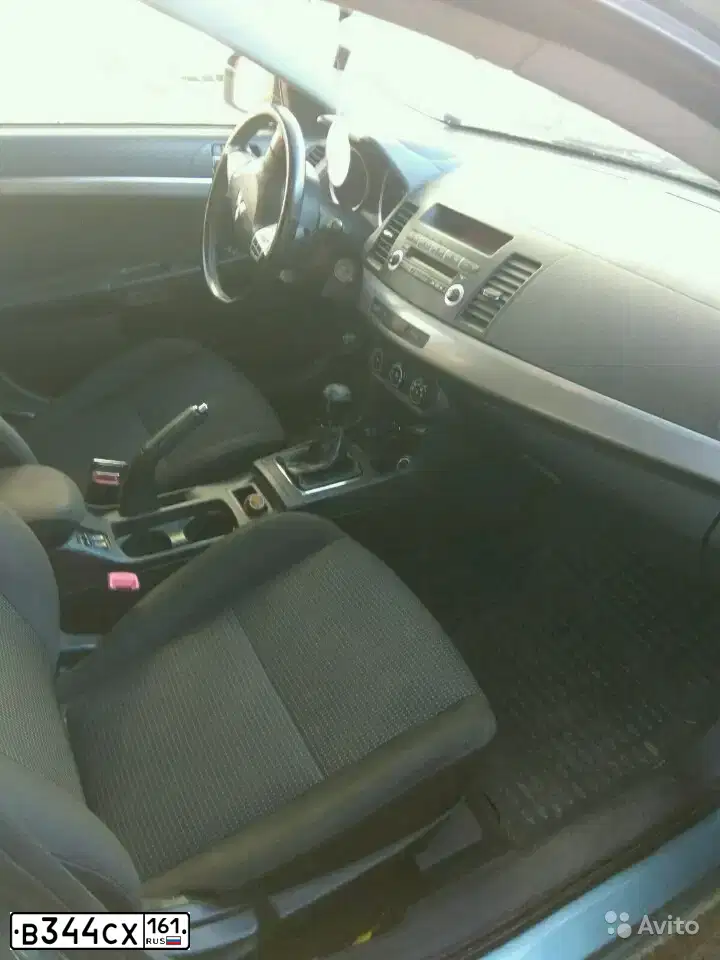Фото автомобиля MITSUBISHI LANCER, 2008 — госномер В344СХ161. Цвет: СВЕТЛО-СЕРО-ЗЕЛЕНЫЙ