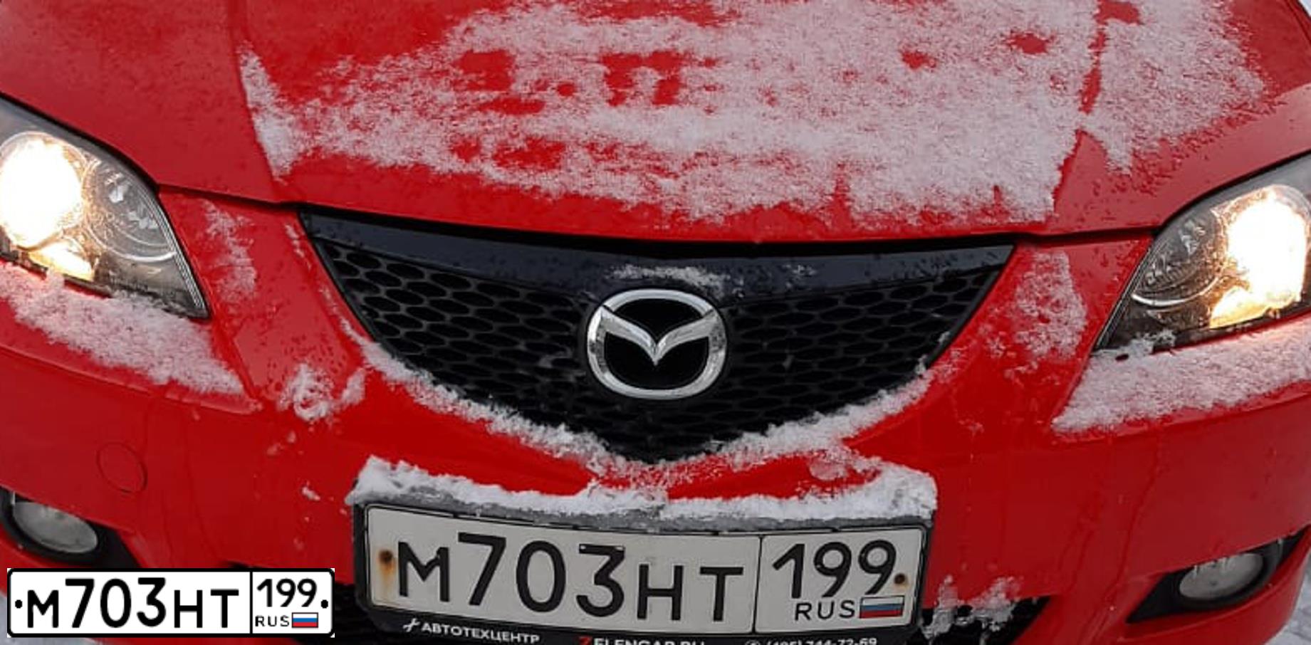 Фото автомобиля MAZDA 3, 2008 — госномер М703НТ199. Цвет: КРАСНЫЙ