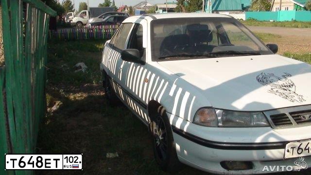 Фото автомобиля LADA 2112, 2003 — госномер Т648ЕТ02. Цвет: СВЕТЛО-СЕРЕБРИСТЫЙ МЕТАЛЛ