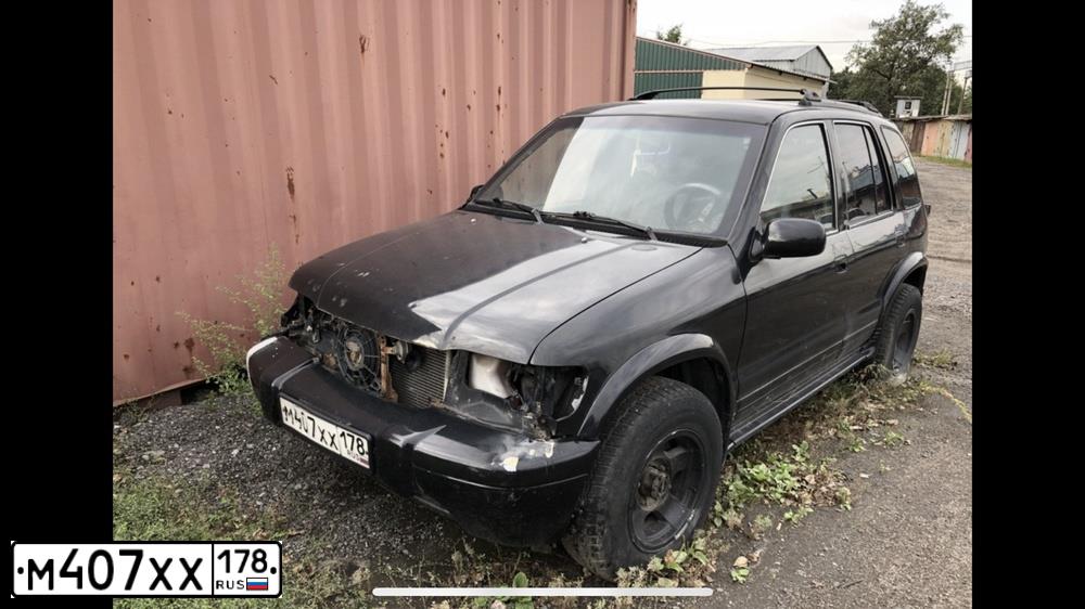 Фото автомобиля KIA SPORTAGE, 1998 — госномер М407ХХ178. Цвет: ЧЕРНЫЙ