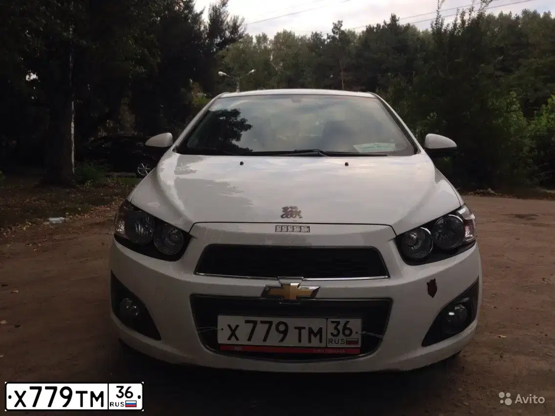 Фото автомобиля CHEVROLET AVEO, 2012 — госномер Х779ТМ36. Цвет: Белый